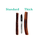 Two dog chew sticks labeled 'Standard' and 'Thick' next to a Sharpie marker for size comparison on a white background.