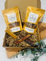 Pure Bites Box – natural dog treat variety pack with chicken feet, yak chew, pig ear strips, and bully sticks for everyday chewing.