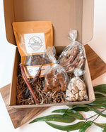 Tiny Tails treat box for small dogs with chicken hearts, bully stick and pumpkin treats