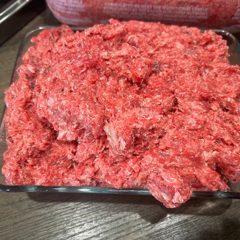 Complete and balanced raw beef dog food made with muscle meat tripe bone and organs