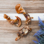 USA-sourced pig ear strips dog treats, natural single-ingredient chew for dogs.