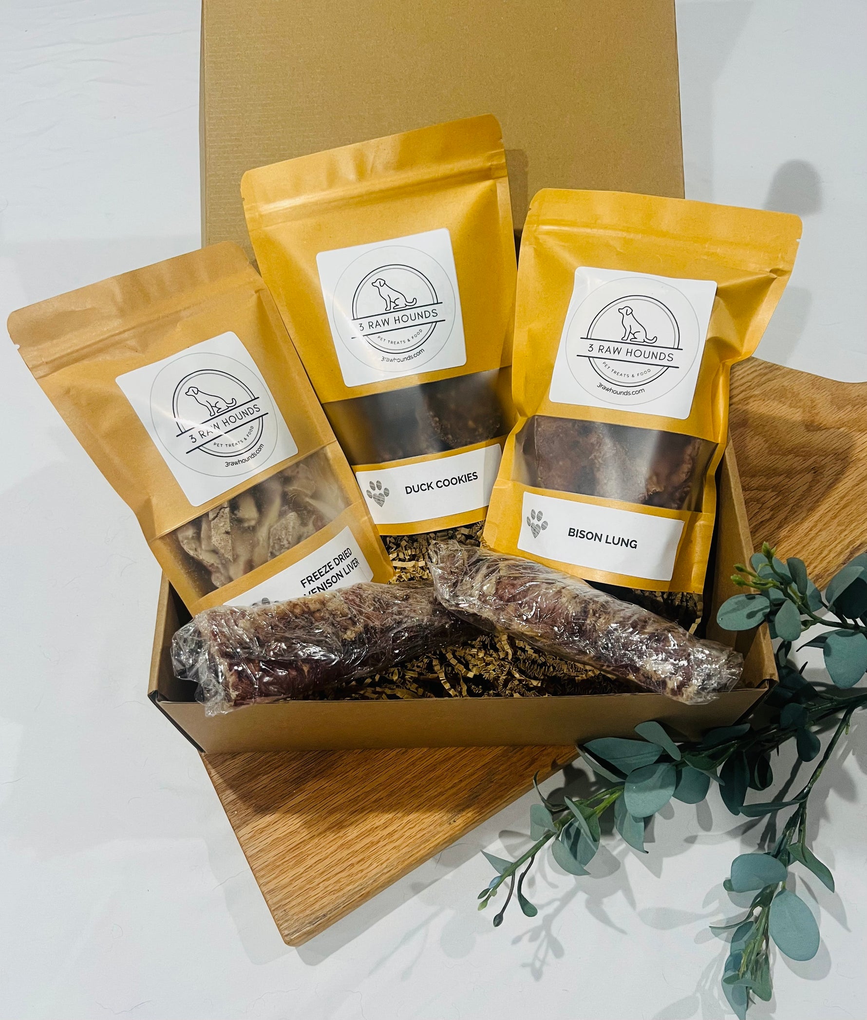 Wild Roots Box – novel protein dog treat variety pack with rabbit jerky, venison liver, bison trachea, duck cookies, and bison lung for sensitive dogs.