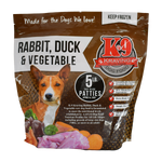 A package of K9 Kraving Rabbit, Duck & Vegetable frozen raw dog food with a picture of a dog on the front.